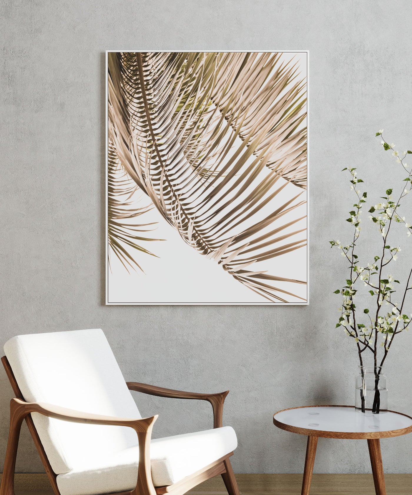 Framed Kentia Palm View print on canvas on a wall above a chair and table